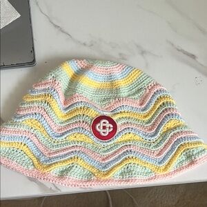 Pastel Striped Crochet Bucket Hat with Red Logo Patch